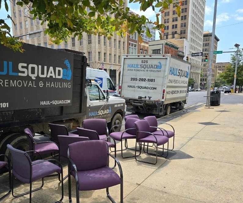 Haul Squad junk removal trucks in downtown Birmingham ready for furniture hauling & cleanout service