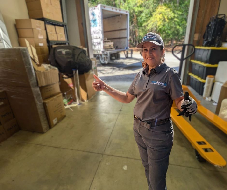 haul squad on locatiion in hoover, al clearing out a warehouse. truck in background