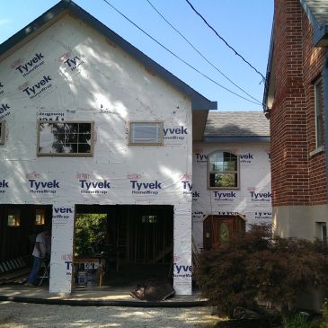 House under construction with Tyvek wrap installed.