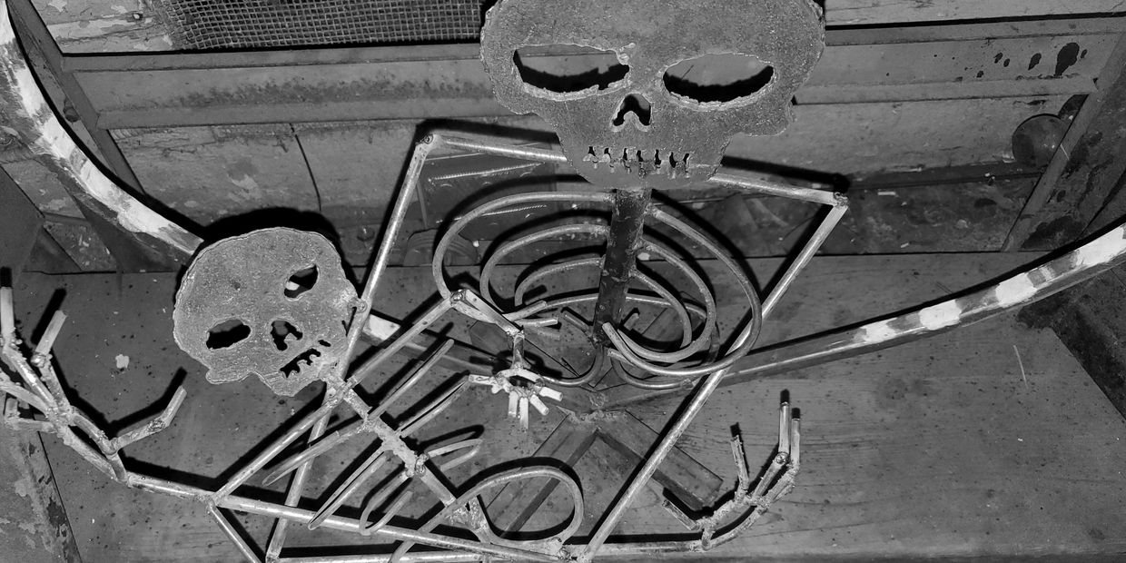 Skeleton Mary holding Skeleton Baby Jesus raw, steel, no paint, welded, embrace, love, hugs, kisses.