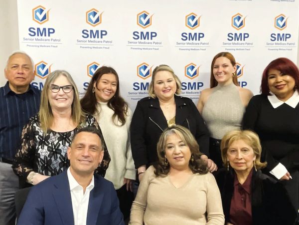 Group photo of nine professionals at SMP event.