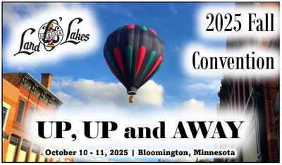 Hot air balloon floats over city streets for 2025 Fall Convention in Bloomington, Minnesota.