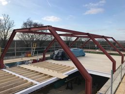 Single story addition to a timber frame barn.
