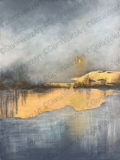 Serene landscape with calm water reflecting golden light.