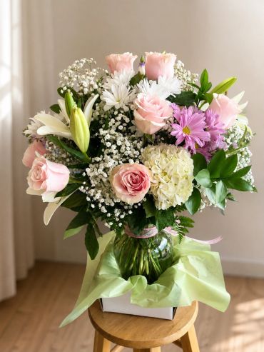 A colorful floral bouquet in a glass vase.