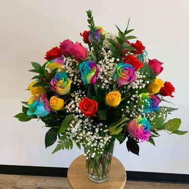 A vibrant bouquet of multicolored and traditional roses.