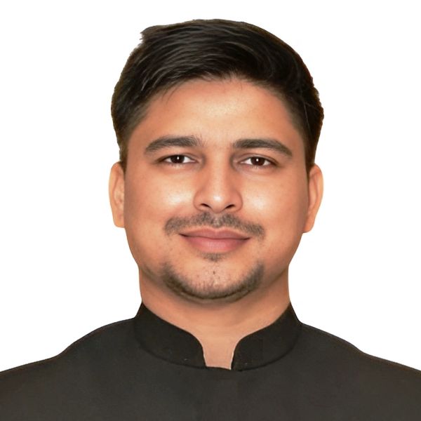 Portrait of a young man with short black hair and a trimmed beard.