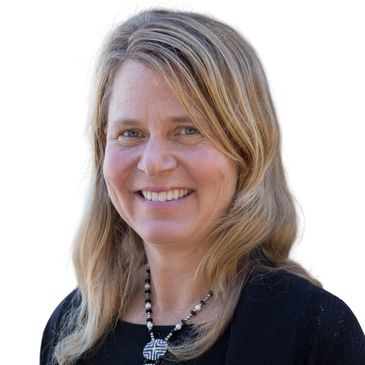 Smiling woman with blonde hair wearing a black top and necklace.