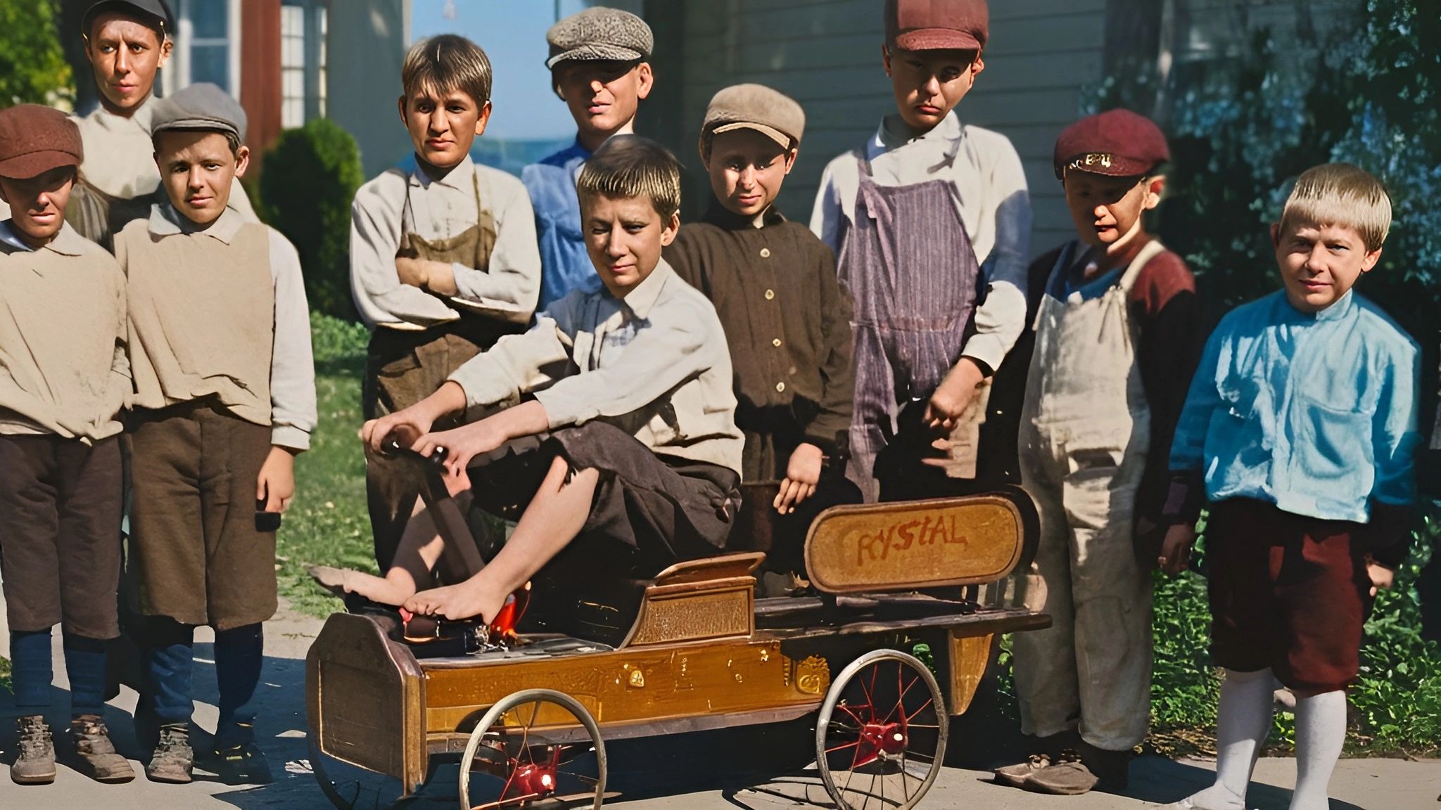 Boys around a pedal car