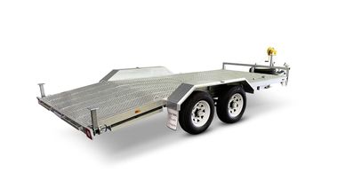 Aluminum dual-axle flatbed trailer with winch and spare tire.