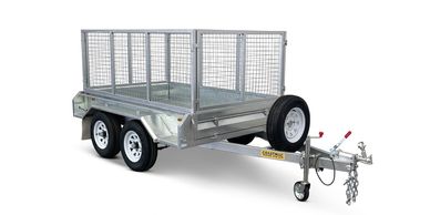 Silver utility trailer with mesh sides and spare tire on white background.