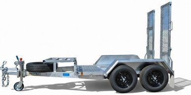 Metal utility trailer with dual axles and loading ramps.