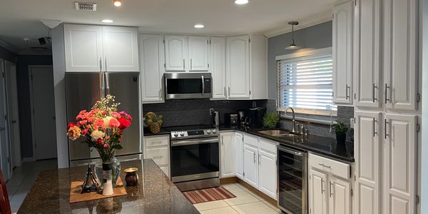 Remodeled Kitchen Design & Cabinet Installation. Featuring Hardwood Cabinets & Granite counter