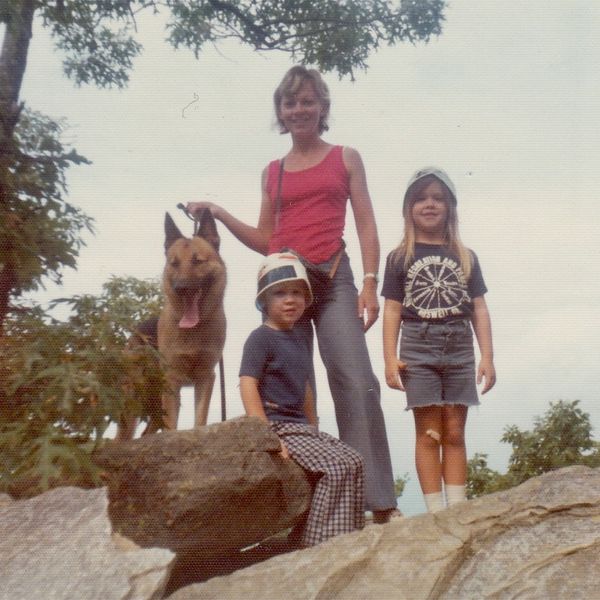 Young family posting on rocks during a hike