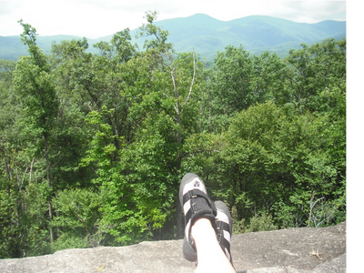 I'm taking a break during rock climbing to look at the view and contemplate mindful choices.