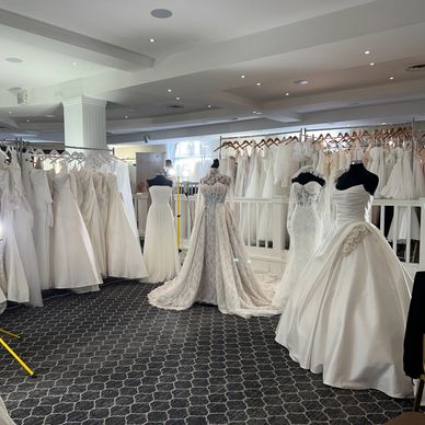 Open-format show floor with bridal gowns on display