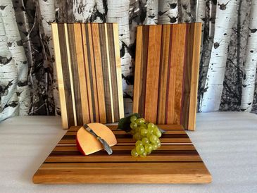 Edge grain cutting boards with various wood species.  Approximately 12"x16"