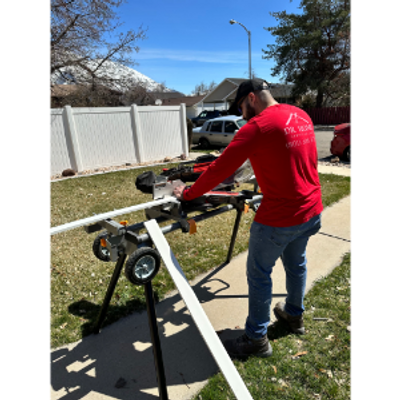 Diego cutting a piece of baseboard before installation. 