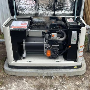 Open standby generator showing internal engine and components.