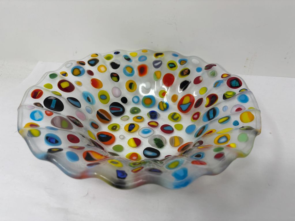Colorful glass bowl with polka dots.