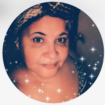 Close-up portrait of a woman with a headband surrounded by sparkling star effects.