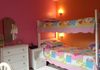 Girl's room bunk bed with sconces