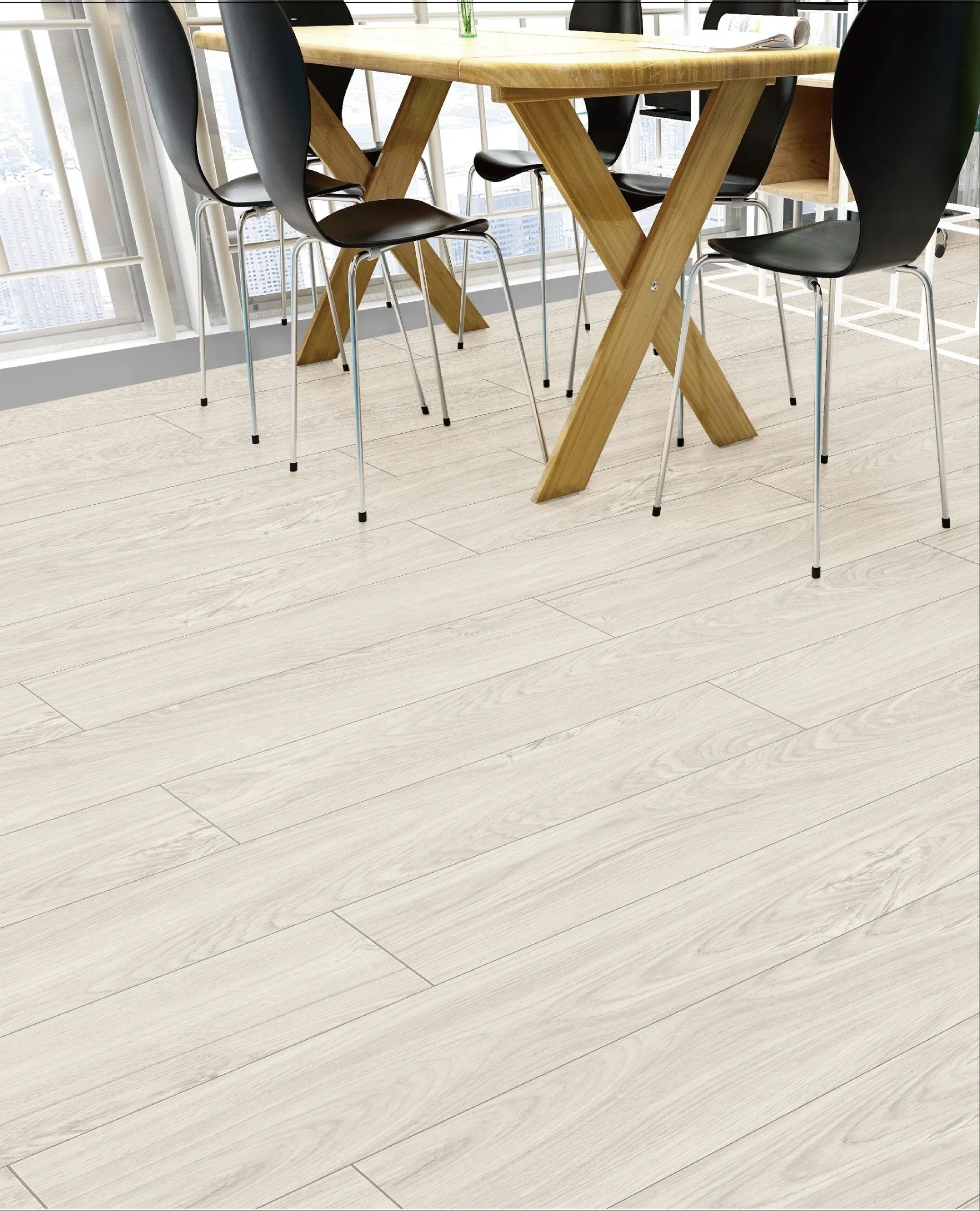 Modern dining area with light wood flooring and black chairs.