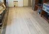 Flooring half installed before wall panelling installed
