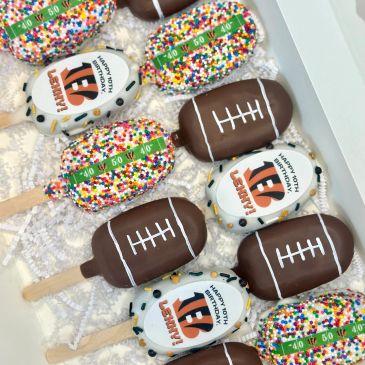 Decorated football-themed popsicles and sprinkles-covered treats.