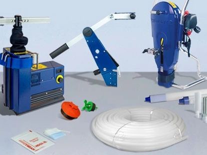 Various mechanical and electronic components arranged on a flat surface.