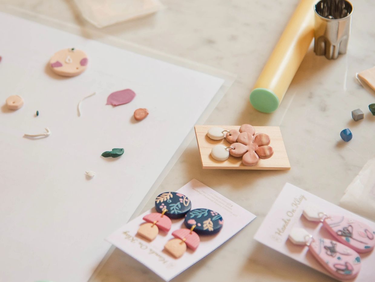 A group of friends enjoying a bachelorette party jewelry making workshop in Singapore, creating hand