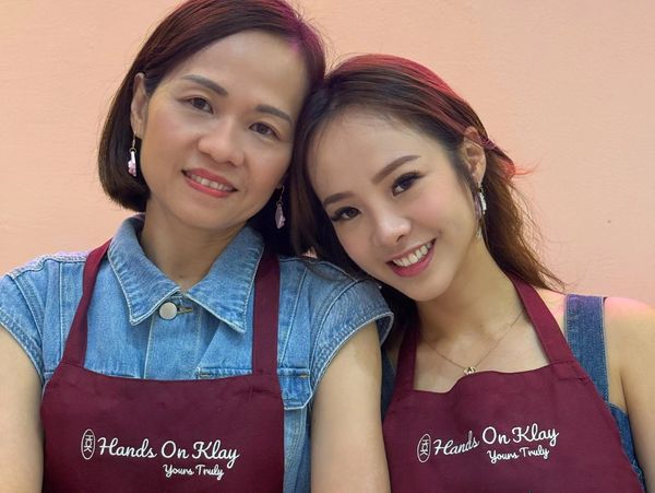Mother and daughter enjoying a creative jewelry making workshop in Singapore, a fun bonding activity