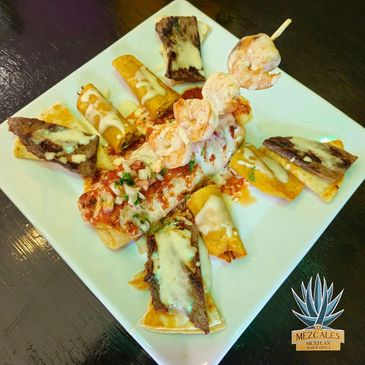 Deep-fried burrito w/ground beef, chicken, rice, beans, cheese sauce, pico, steak, shrimp, taquito.