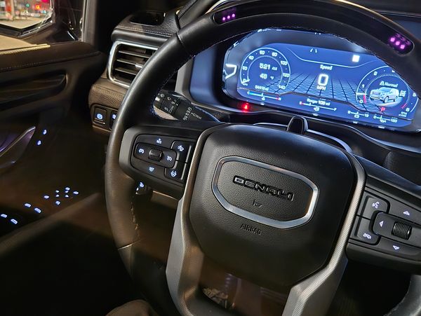 GMC Denali steering wheel with digital dashboard.
