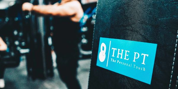 Man working out behind branded bench.