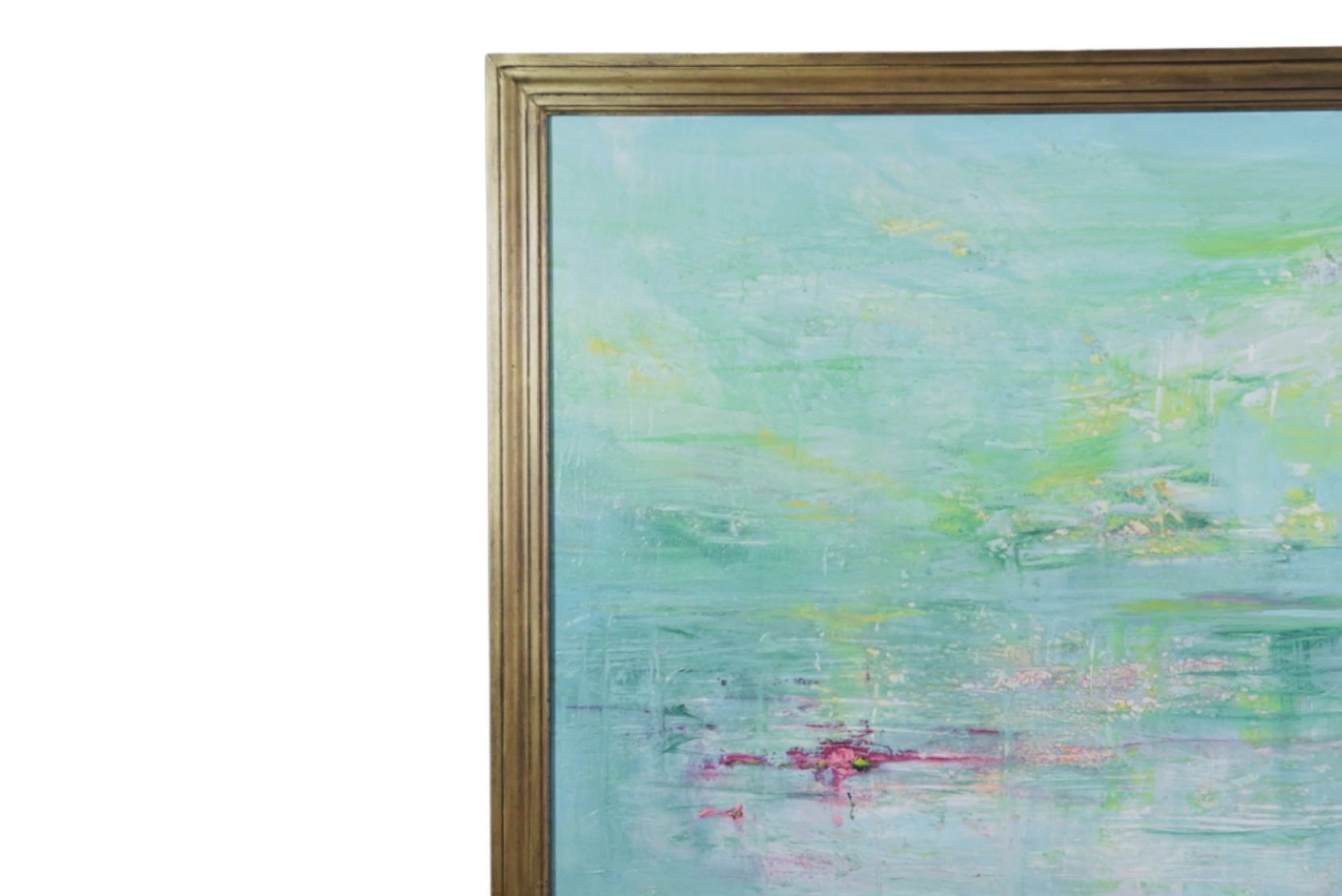 Abstract painting with soft blues and greens in a gold frame on an easel.