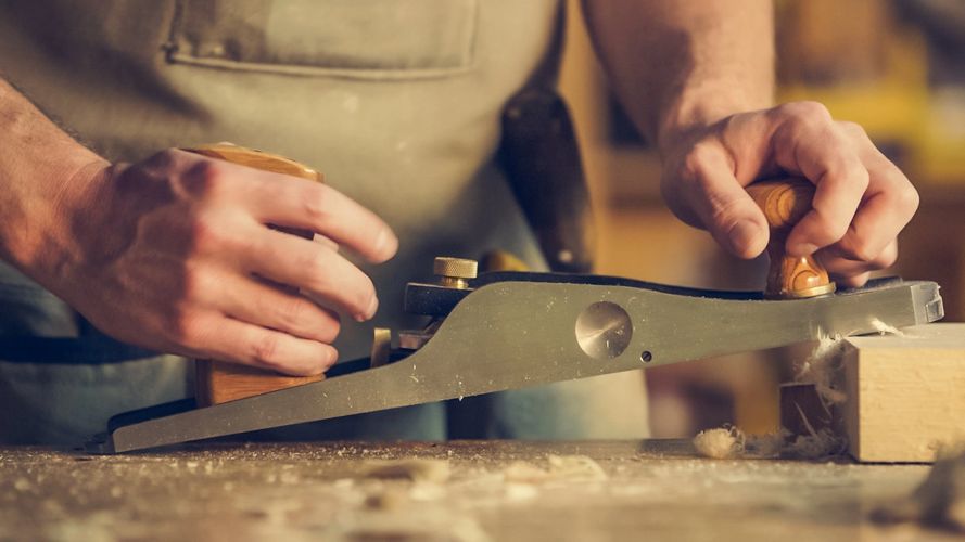 A man planing a block of wood