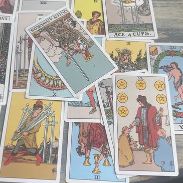 Spread of tarot cards on a table.
