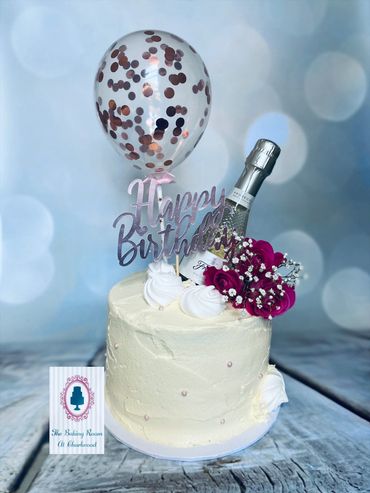 Buttercream cake with balloon champagne flowers