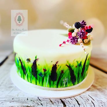 Hand painted wild garden on fondant icing with wild flower fondant decoration and painted bee