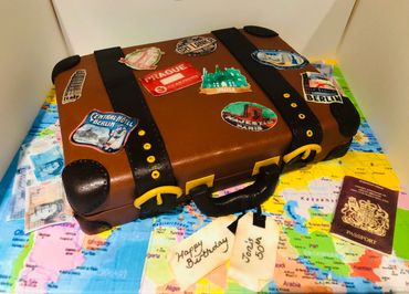 Suitcase cake with edible travel stickers