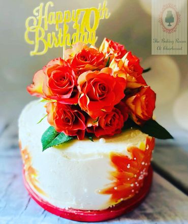 Buttercream cake with orange roses