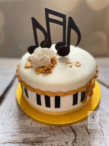 Piano themed cake with musical notes