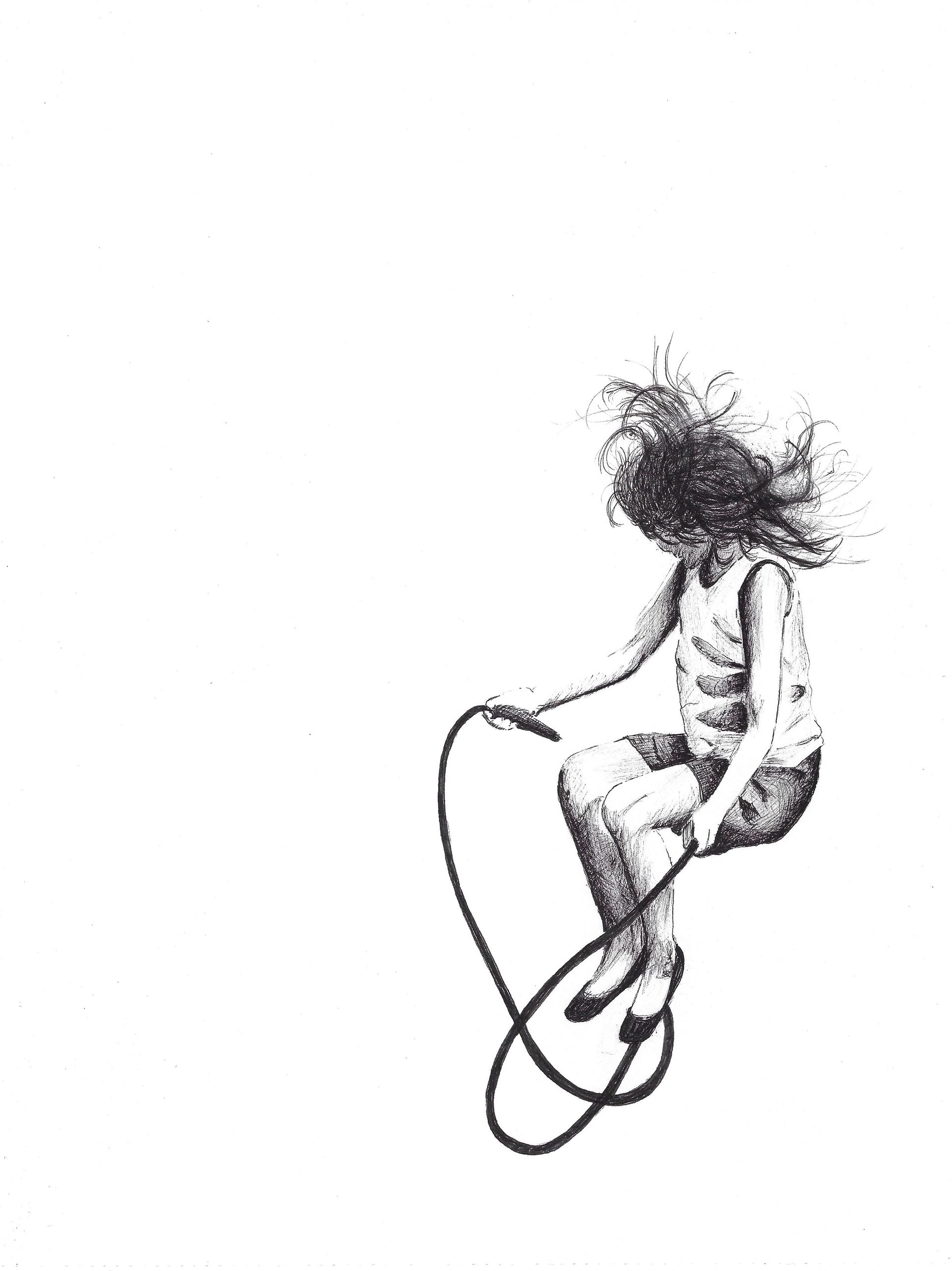 Young girl jumping rope