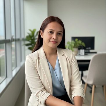 Professional woman posing confidently in a modern office setting.