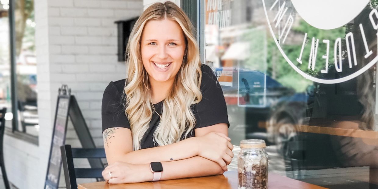 Girl sitting at table smiling