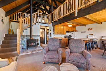 Cozy cabin interior with rustic wood accents and comfortable seating.