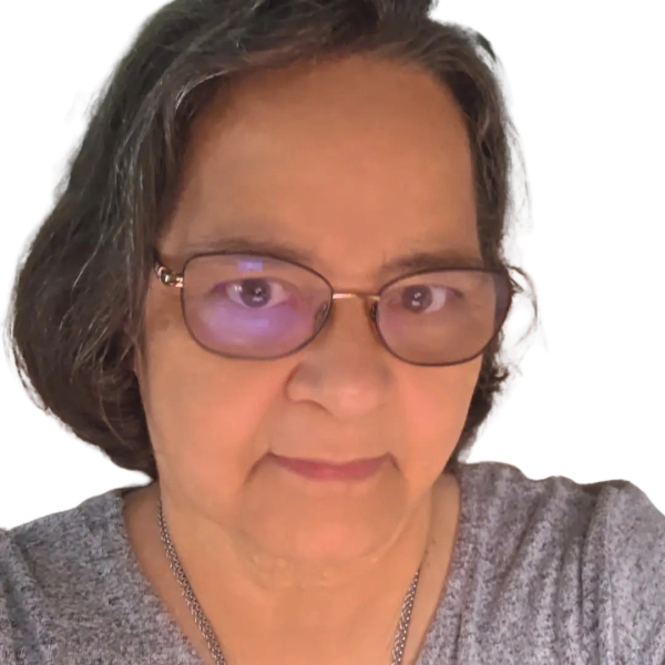 Middle-aged woman with glasses and gray hair.