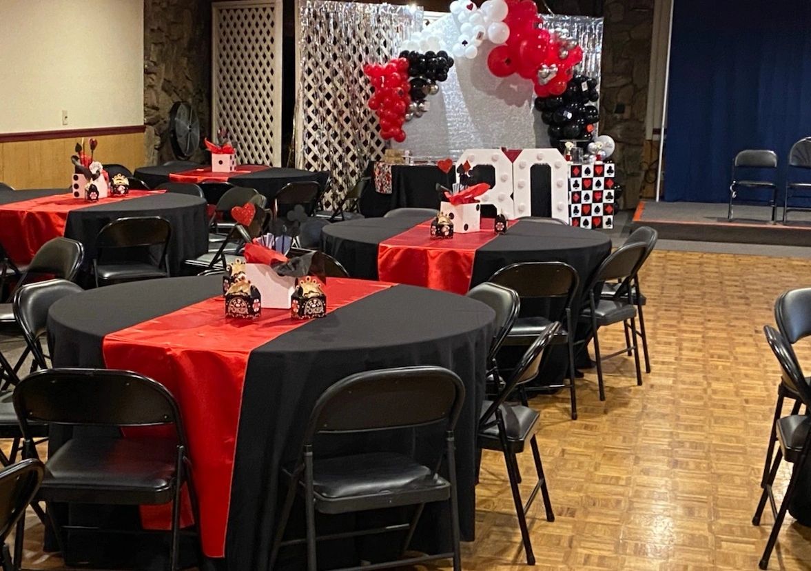 A photo taken in the Lodge Room showing classy table decorations set up by a renter for an 80th birt