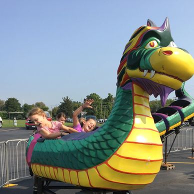 children  on ride at amusement park
